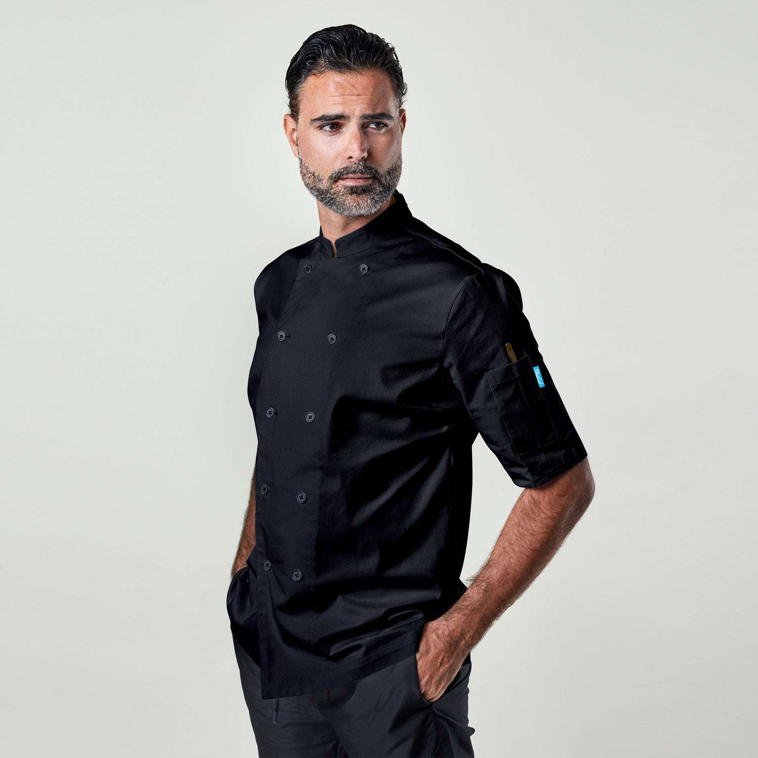 Image of person wearing Ambassador shirt in black. | BlueCut Aprons