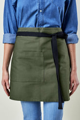 Image of person wearing Briston Waist Apron in Olive Canvas. | BlueCut Aprons