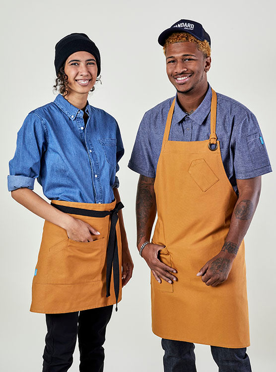 Image of people wearing aprons and shirts. | BlueCut Aprons			