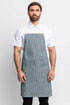 Front view of a man wearing an railroad stripe denim apron