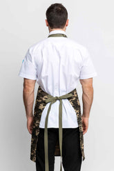 Back view of a man wearing a camo apron.