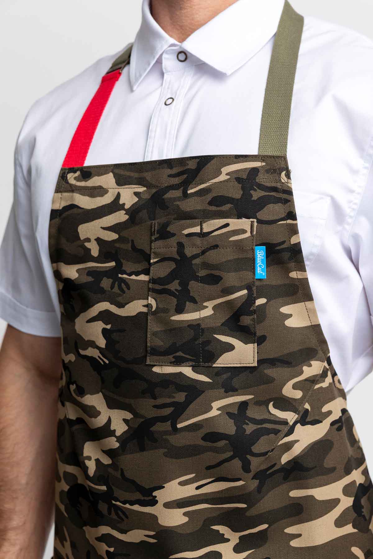 Detailed close-up of camo apron worn by a man.
