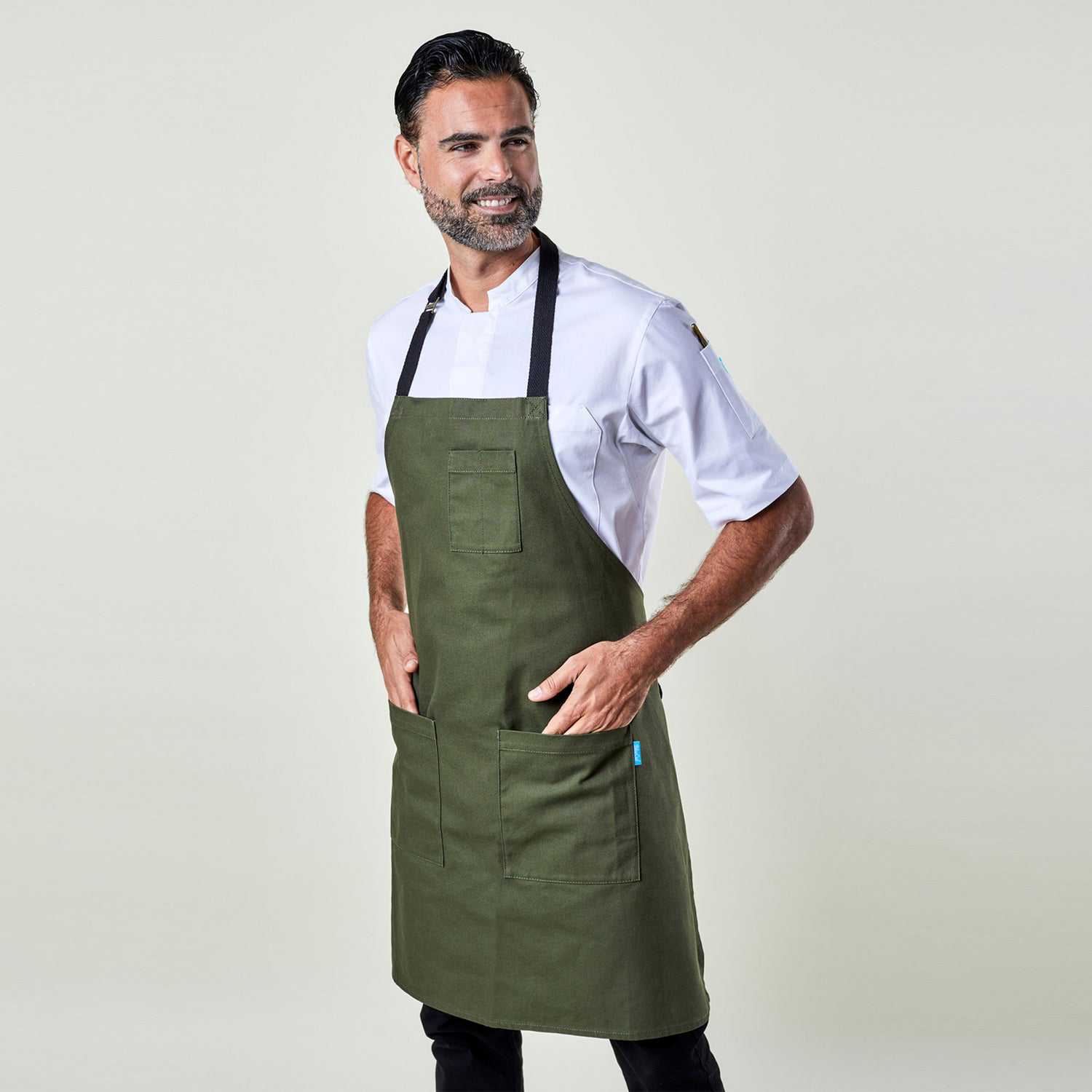 Image of person wearing Mise Canvas apron in olive. | BlueCut Aprons