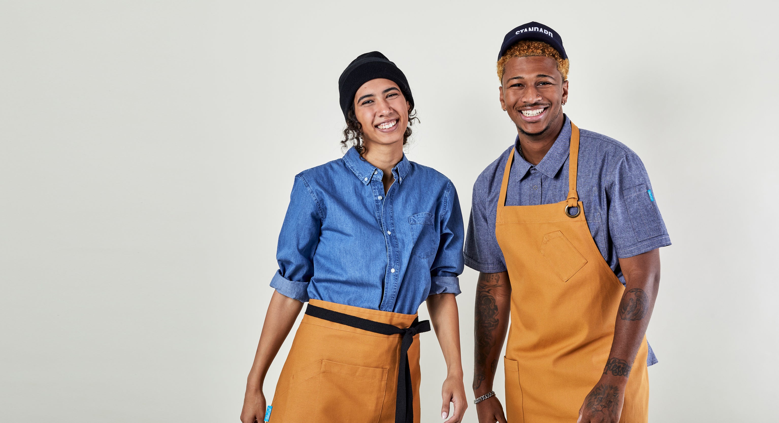 Image of people wearing aprons and shirts. | BlueCut Aprons				