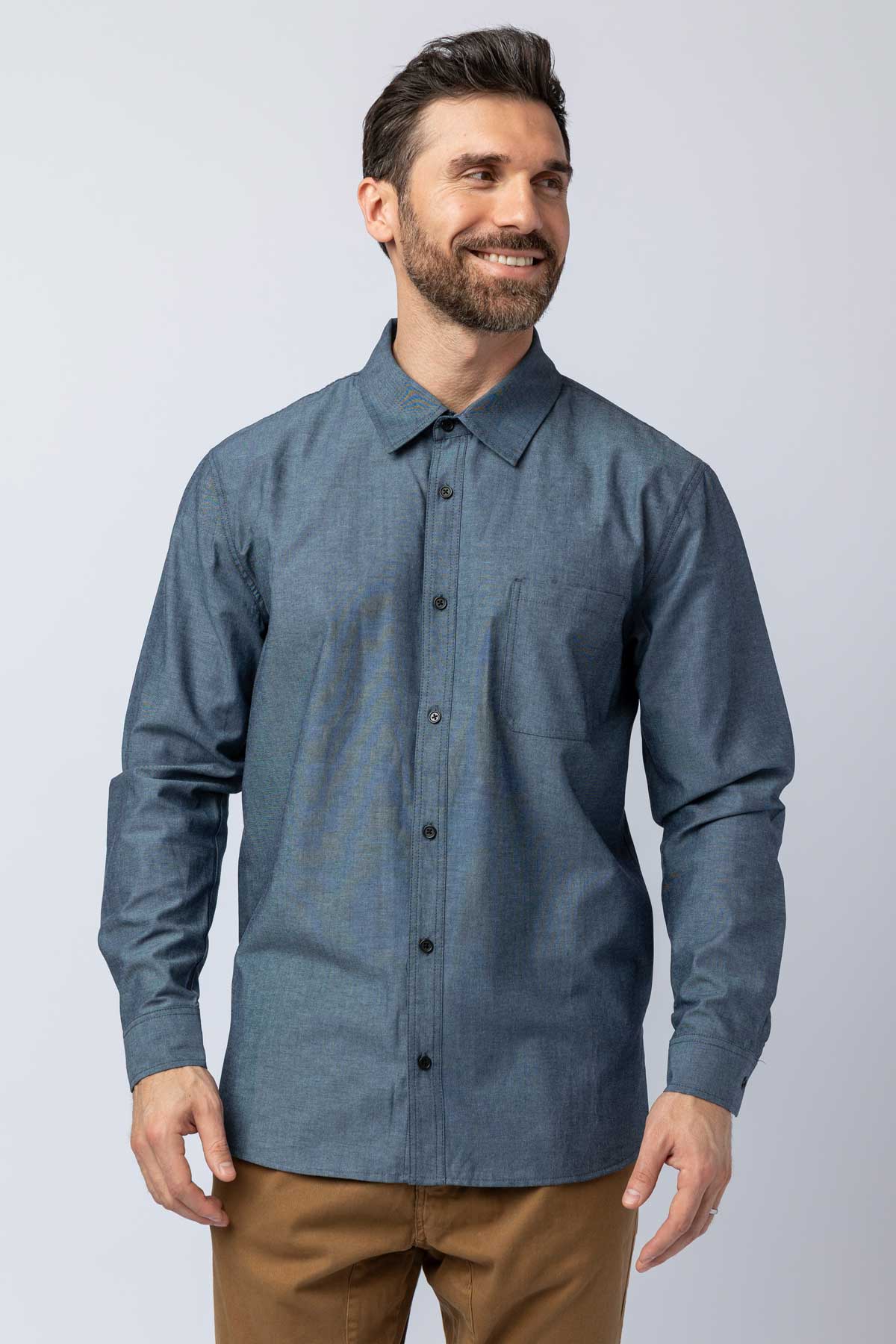 Men wearing blue long-sleeve chambray button-down shirts.