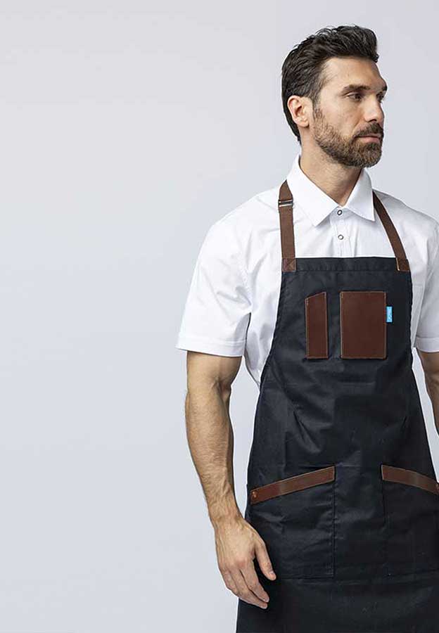 Men wearing a navy blue apron with leather details.