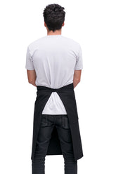 A back view of a man wearing a black bistro apron.
