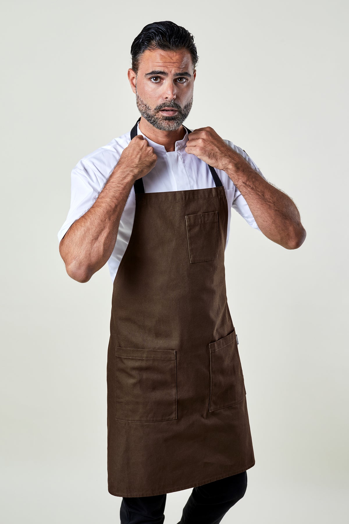 Image of person wearing Mise Canvas apron in brown. | BlueCut Aprons