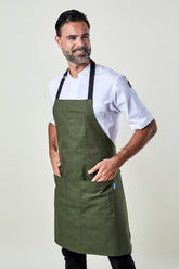 Image of person wearing Mise Canvas apron in olive. | BlueCut Aprons