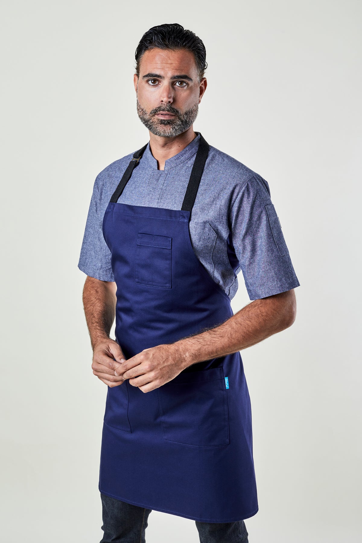 Image of person wearing Mise Apron in Midnight Twill. | BlueCut Aprons