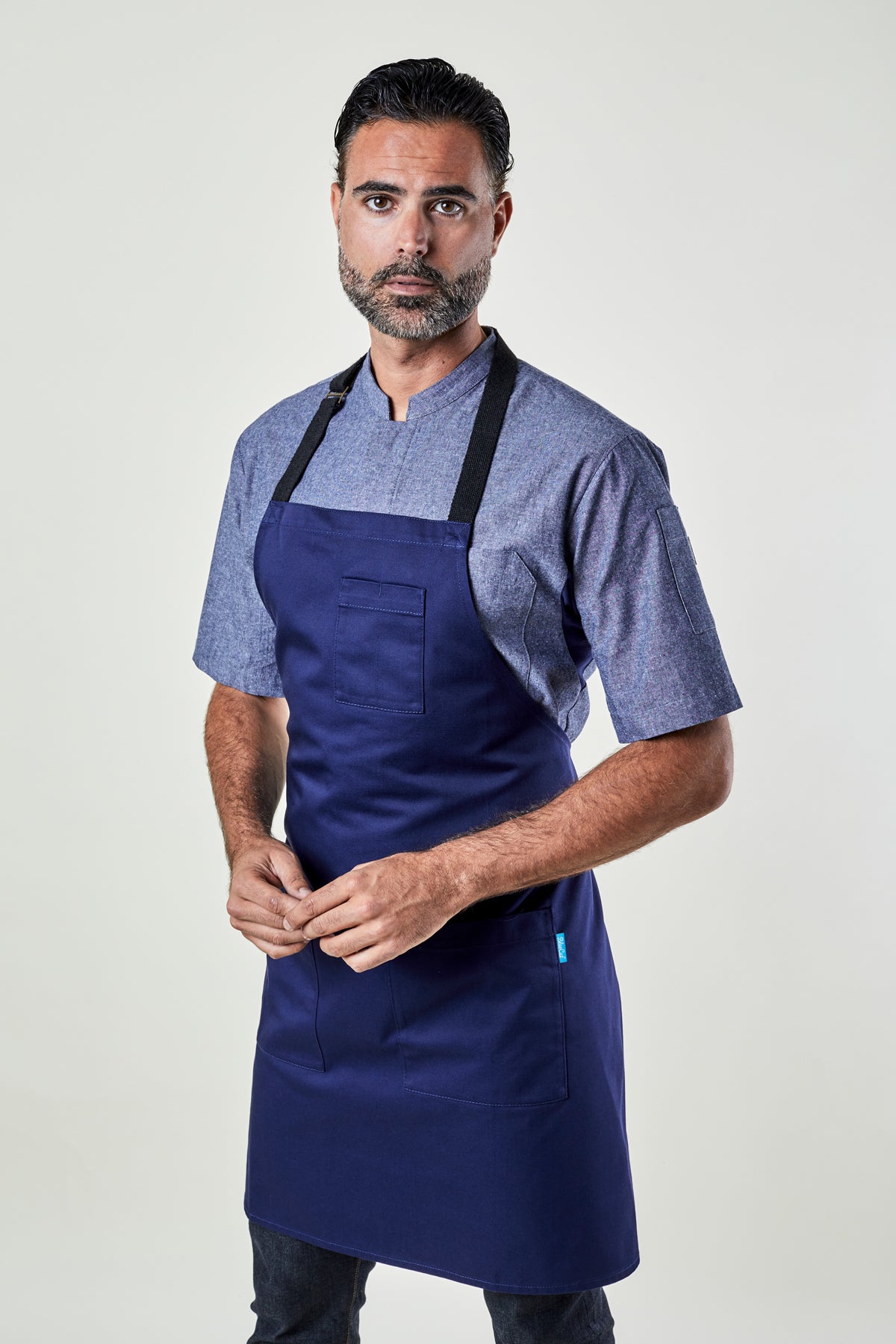 Image of person wearing Mise Apron in Midnight Twill. | BlueCut Aprons				