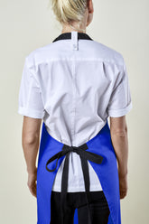 Image of person wearing Mise Canvas apron in french blue. | BlueCut Aprons