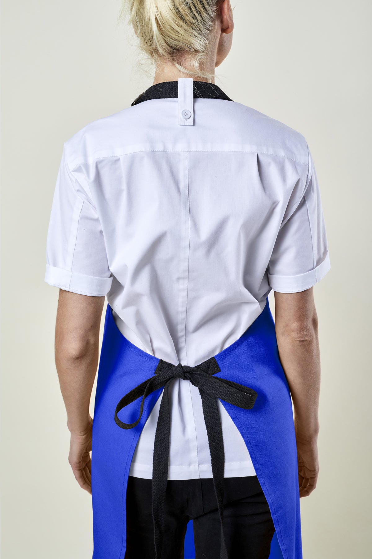 Image of person wearing Mise Canvas apron in french blue. | BlueCut Aprons