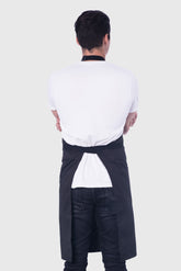 Back view image of person wearing Line Apron in Black Poly Cotton Twill. | BlueCut Aprons