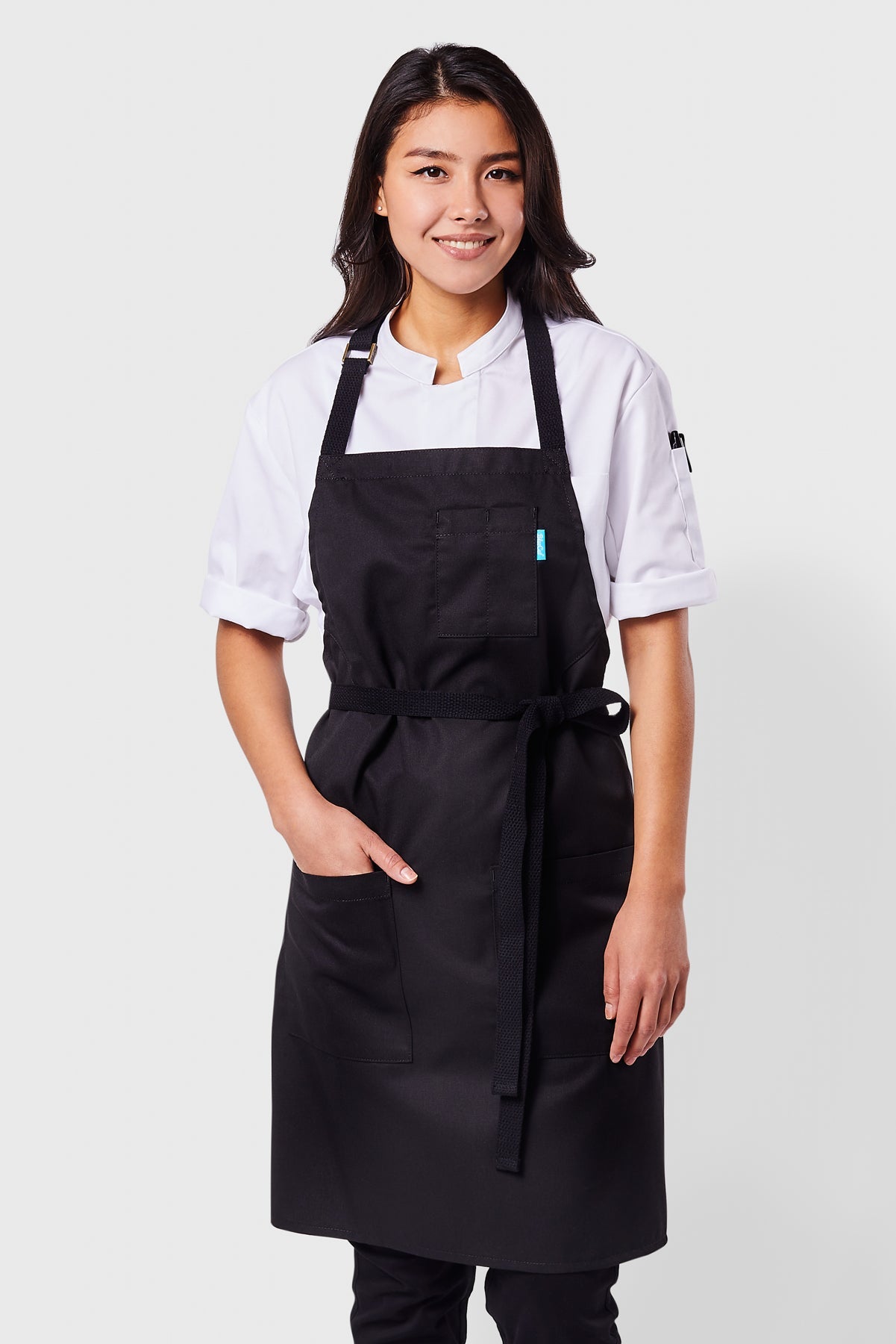 Image of person wearing Line Apron in Black Poly Cotton Twill. | BlueCut Aprons				