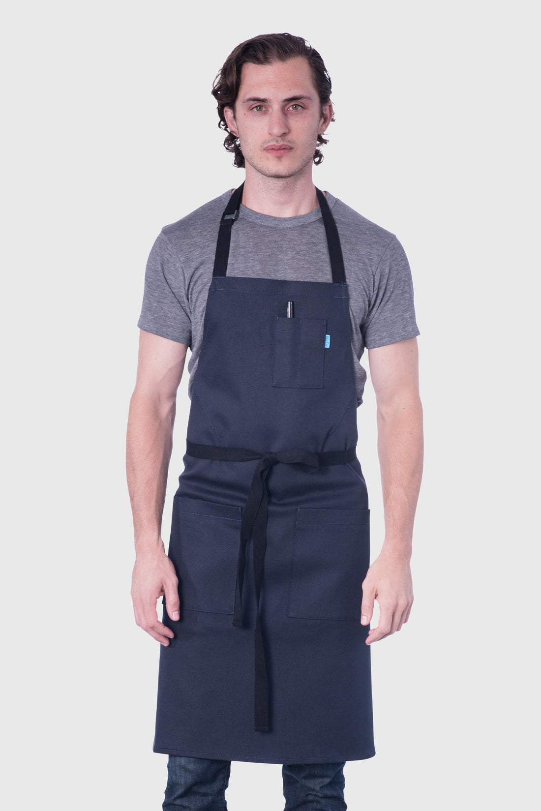 Image of person wearing Line Apron in Poly Cotton Twill. | BlueCut Aprons				