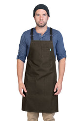 Image of person wearing Lucca Crossback Apron in Dark Brown Canvas. | BlueCut Aprons