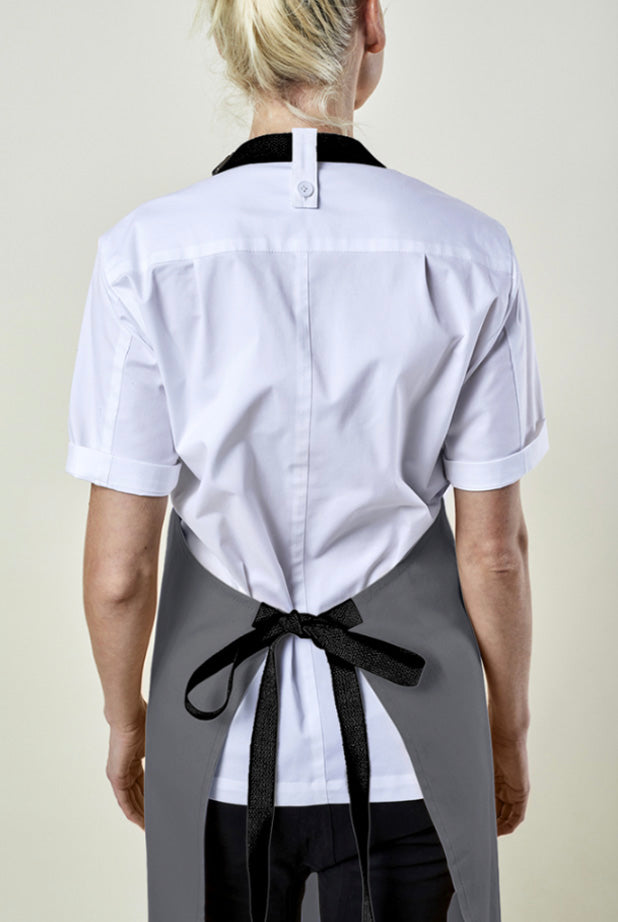 Back view image of person wearing Rapid Custom Bib Apron in Canvas. | BlueCut Aprons