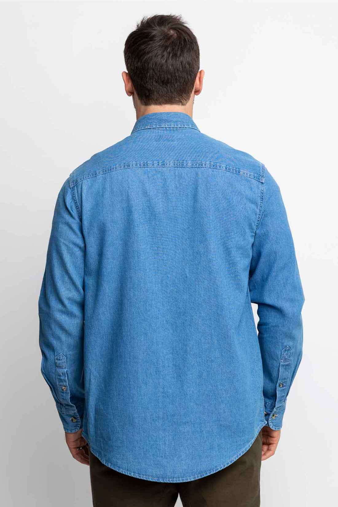 Rear view of men wearing long-sleeve denim button-down shirts.