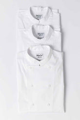 Stack of Ambassador chef coats in white