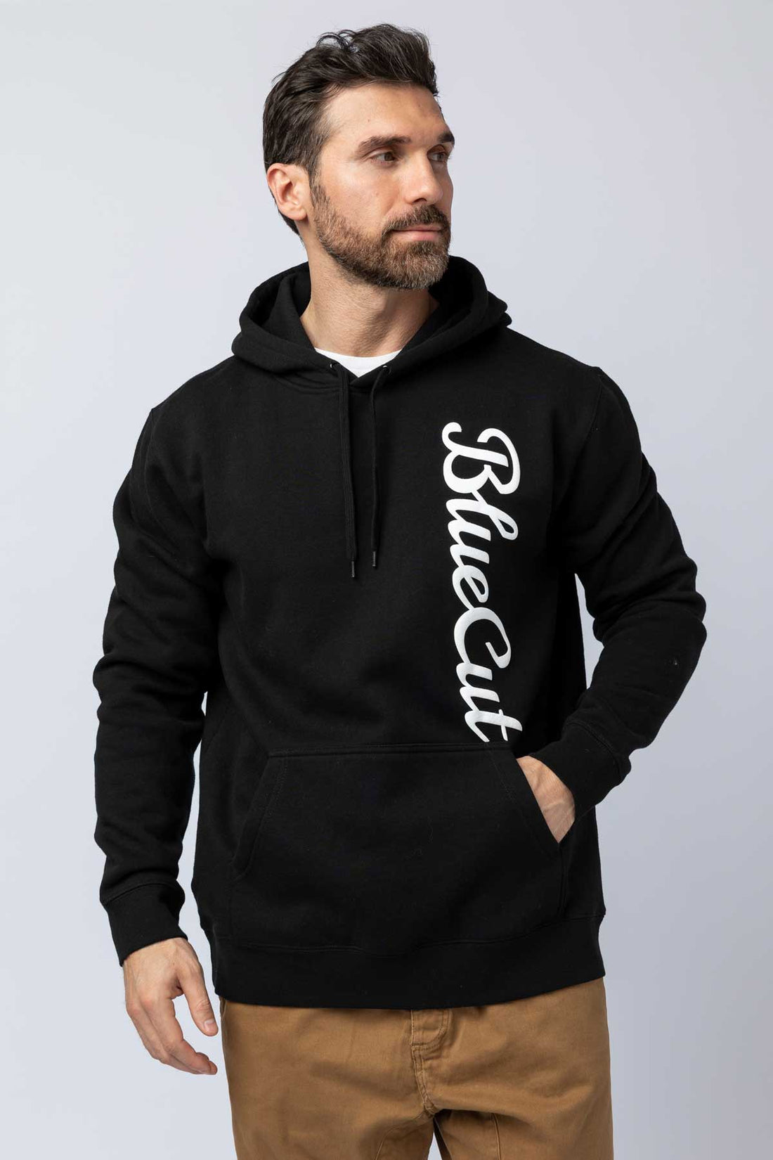 Man wearing a black hoodie featuring the BlueCut logo.