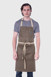 Image of person wearing Line Apron in Taupe Cotton Twill. | BlueCut Aprons