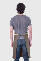 Back view image of person wearing Line Apron in Taupe Cotton Twill. | BlueCut Aprons