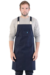Image of person wearing Hatfield Crossback Apron in Navy Canvas. | BlueCut Aprons