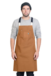 Image of person wearing Hatfield Crossback Apron in Whiskey Canvas. | BlueCut Aprons
