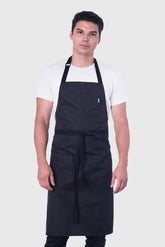 Image of person wearing Line Apron in Black Poly Cotton Twill. | BlueCut Aprons				