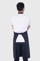 Back view image of person wearing Line Apron in Black Poly Cotton Twill. | BlueCut Aprons				