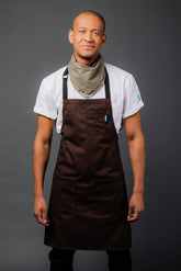 Image of person wearing Line Apron in Cacao Cotton Twill. | BlueCut Aprons