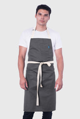 Image of person wearing Line Apron in Grey Cotton Twill. | BlueCut Aprons