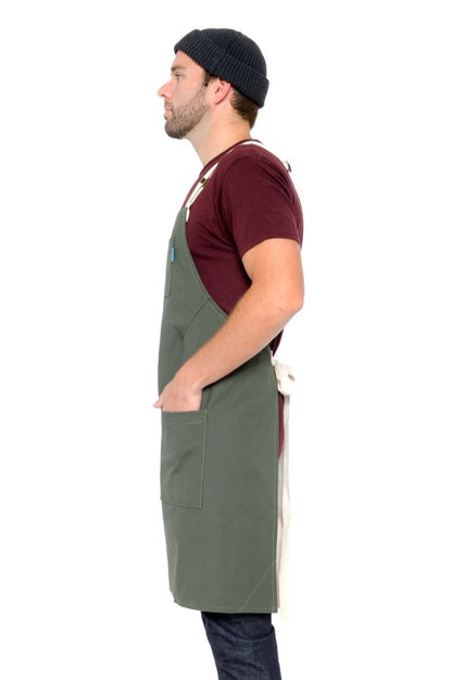 Side view image of person wearing Lucca Crossback Apron in Olive Canvas. | BlueCut Aprons				
