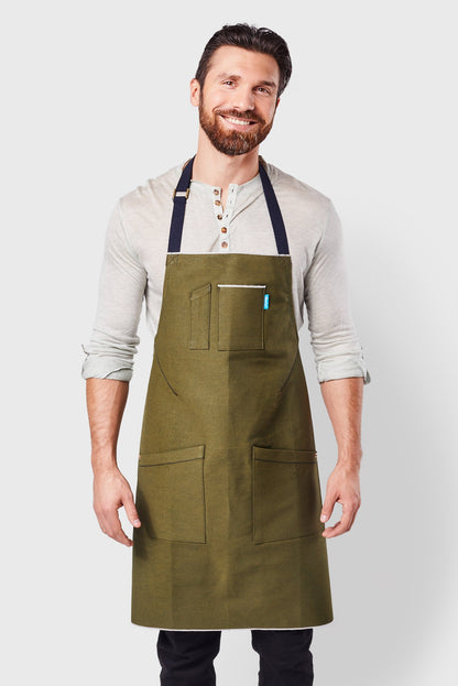 Image of person wearing Mason Apron in Olive Selvage Denim. | BlueCut Aprons