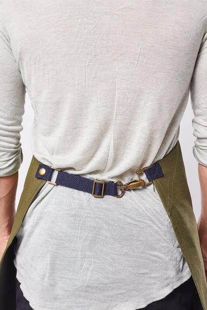 Back view image of person wearing Mason Apron in Olive Selvage Denim. | BlueCut Aprons