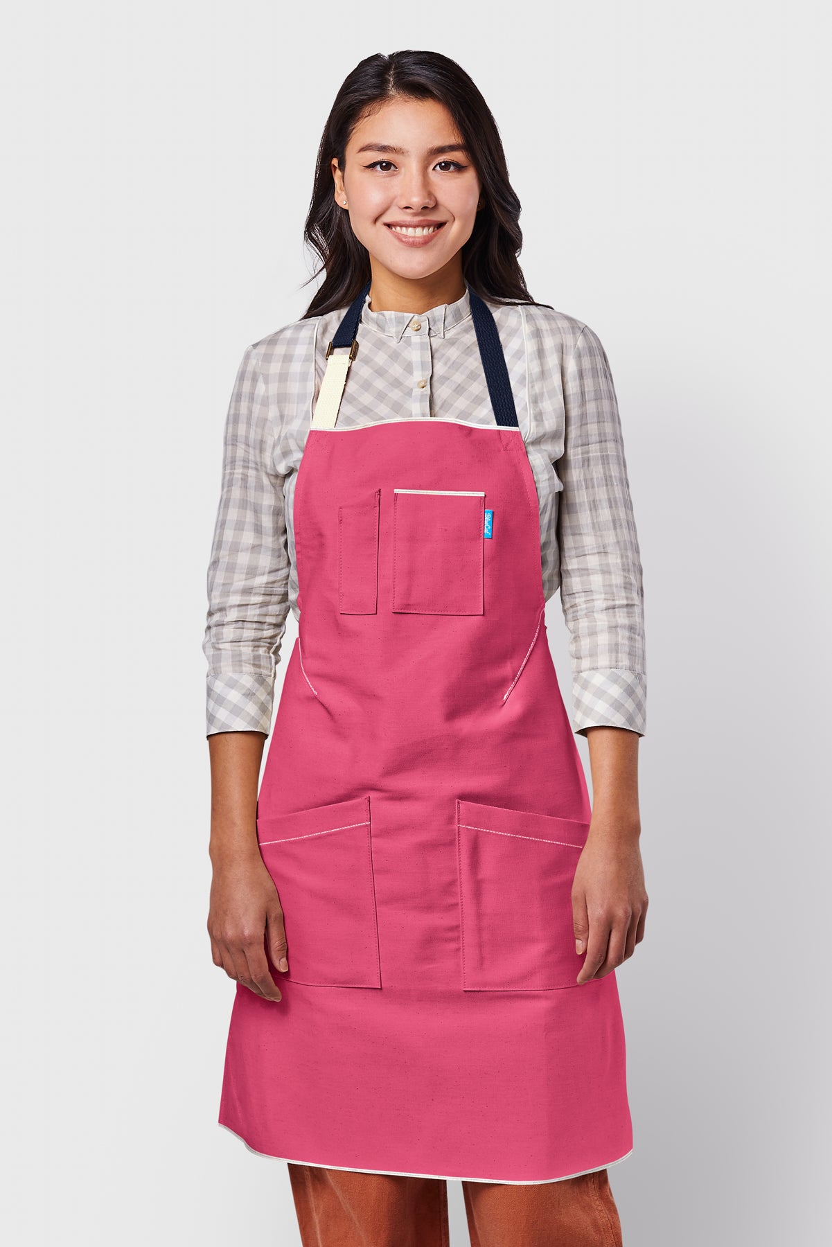 Image of person wearing Mason Apron in Bubble Gum Selvage Denim. | BlueCut Aprons