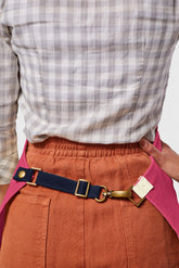 Back view image of person wearing Mason Apron in Bubble Gum Selvage Denim. | BlueCut Aprons