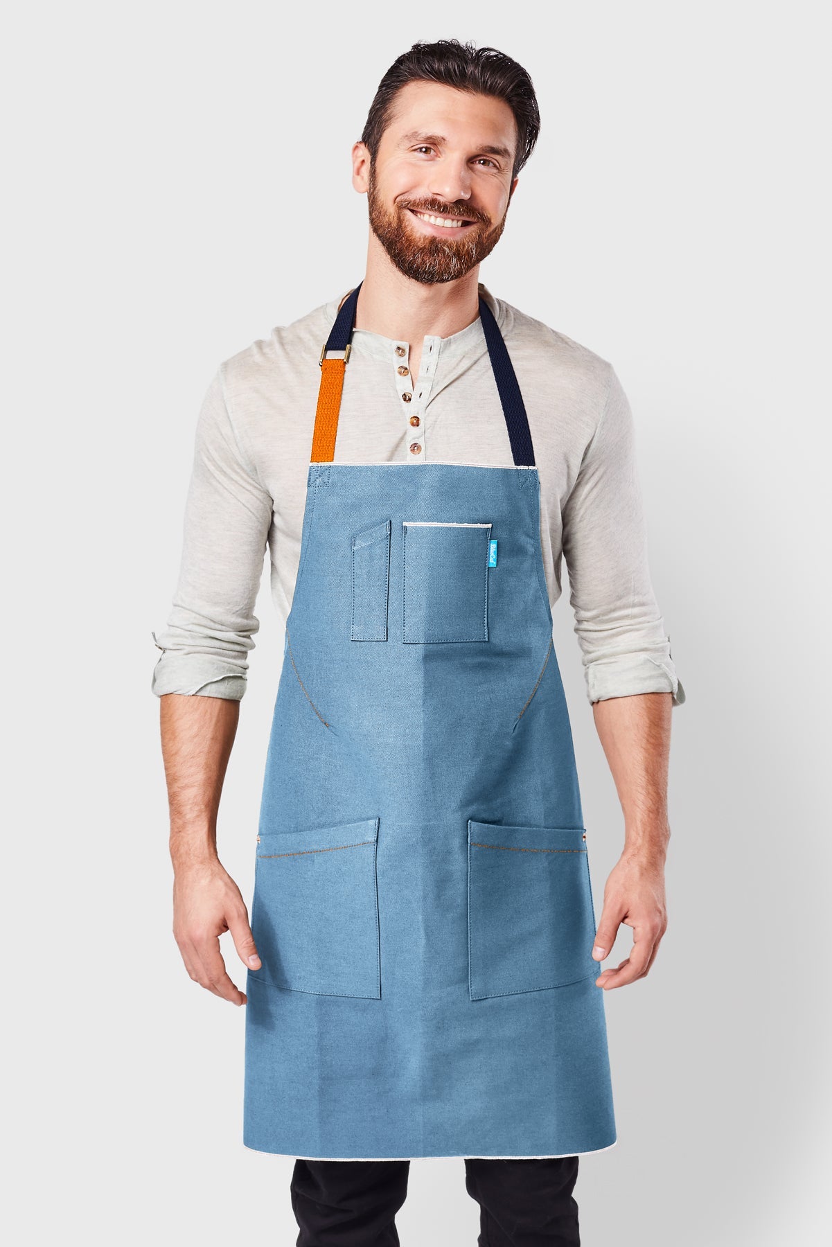 Image of person wearing Mason Apron in Sky Blue Selvage Denim. | BlueCut Aprons